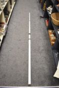 A telescopic surveying measuring staff