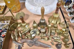 A collection of brassware and trinkets including scales, bells, animal studies etc.