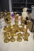 Seven pairs of brass candlesticks etc.