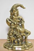 A 19th/20th Century brass plated door porter in the form of Punch and his dog Toby, measuring 30cm