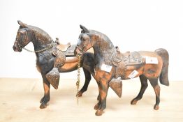 A pair of mid-20th Century spelter carnival horse ornaments, painted in a copper colour, each
