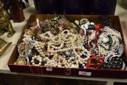 A large collection of costume jewellery, including beaded necklaces, a Mexican silver bangle,