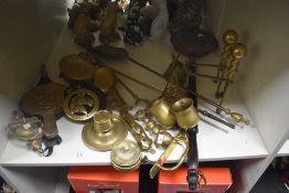 A selection of assorted brassware including a tall companion set and matching firedogs, alcohol