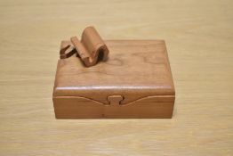 An unusual puzzle style trinket box, signed Richard Rothland to the base.