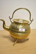 A 19th/20th Century Indian brass kettle, having embossed foliate design to the shoulder and raised