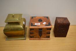 Three assorted boxes, one being a stylised brass and two wood.