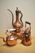 A 19th Century Persian copper coffee pot with stylised brass handle, measuring 45cm tall, a 19th/