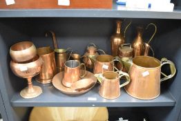 An assorted collection of 19th and 20th Century copperware, to include three graduated measures by