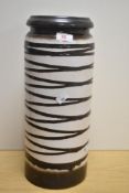 A 1970s West German pottery vase, decorated with a zig zag pattern, in a brown and cream glaze,