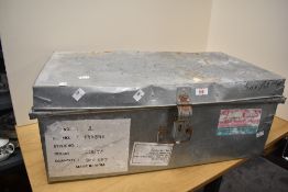 A large metal trunk having age related damage to lid, measures 68cm x 37cm x 28cm.