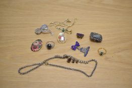 A small assortment of costume jewellery including a marcasite bow motif brooch, two paste set