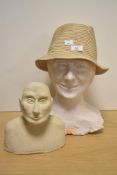 A large plaster bust of a smiling lady, measuring 35cm high, and another bust