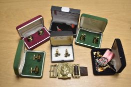 A group of five pairs of cufflinks comprising a clover motif pair set with Connemara marble, a