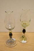 Two 20th Century decorative nosing glasses, having swirl design to the knopped stems and footed