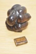 A carved hardwood weeping Buddha and an antique treen snuff box.