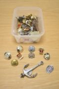 A selection of military uniform buttons and badges.