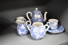 A 20th Century Chinese blue and white teapot, with bamboo effect handle, together with two coffee