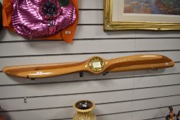 A Bristol fighter plane wooden propeller with inset clock, measures 127cm.