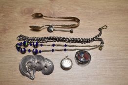 An assortment of miscellaneous silver and white metal items including a silver circular locket