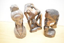 Three 20th century carved hard wood figures, including Geisha.