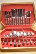 An early 20th Century oak canteen of silver plated Queen's pattern cutlery