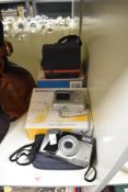 Three assorted vintage cameras, a Polaroid Supercolour 645 CL, A Kodak EasyShare C433 and a