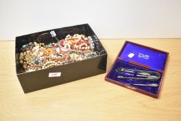 A large collection of costume jewellery, including various beaded necklaces, brooches including