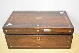 A Victorian rosewood writing slope with ink wells and Mother of Pearl inlaid detail to top and