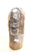 An African carved hardwood bust, depicting gent with beard.
