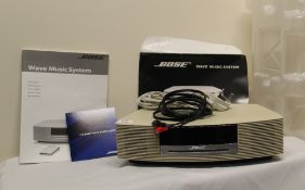 A Bose Wave Radio / music system - boxed - in ivory colour with remote - appears to have never