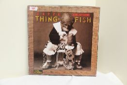 A Frank Zappa ' Thing Fish ' triple set with some box wear - inside is VG+