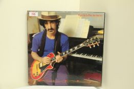 A Frank Zappa triple 1981 ' Shut up 'n' play yer Guitar ' vinyl box set , vinyl is ex - the box