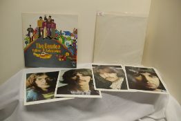 A lot of two Beatles albums with a White album with inners and a later Yellow Submarine