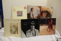 A lot of six albums by Paul Simon