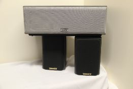 A pair of Tannoy Speakers with stands m/R B/eye and Sub Woofer MXC