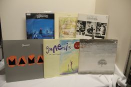 A lot of ten vinyl albums by Genesis - viewing recommended