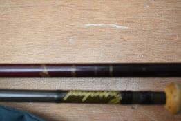 A Laser Boron 3pc 11ft 4in fly rod and a copperhead 7ft 2pc fly rod both in soft sleeves