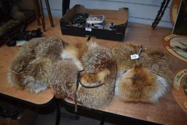 Three fox fur hats