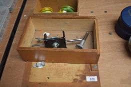A fly tying vice in original wooden box and some line for making casts