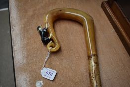 A Shepards crook depicting a figure of a sheepdog length 125cm