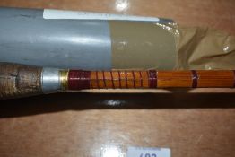 A shakespeare 2pc omni fly rod 2.7meters and a 10ft split cane spinning rod in original soft sleeve