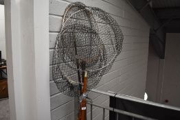 Four vintage fishing rods and three landing nets