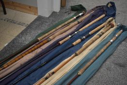 A selection of 6 vintage fishing rods mostly unmarked or marks worn off, An interesting selection