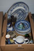 A selection of blue and white ware including an English delft platter and jugs, a blown glass bird