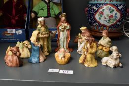 A vintage eleven piece ceramic nativity set in original box with a few sympathetic additions.
