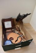 A small collection of African themed items including a set of 6 soapstone coasters in a holder, a