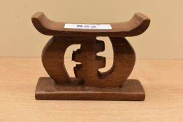 A miniture carved hardwood Ashanti stool.