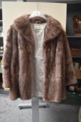 A vintage ladies brown fur jacket 44' approx.