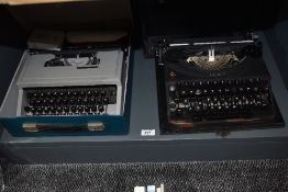 A vintage Oliver portable type writer in hard case sold alongside an Olivetti Dora portable