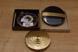 Three machine tooled Stratton compacts, new in box.